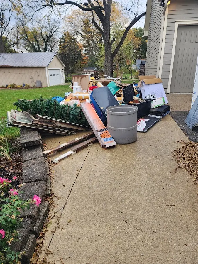 Dumpster being loaded with debris for Roofing Dumpster Rental in Chantilly